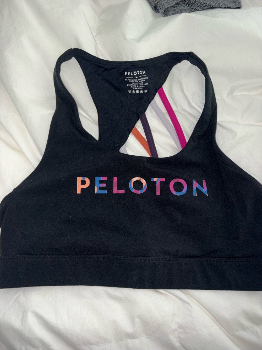 Peloton Black Sports Bra with Multicolor Logo and Strappy Back